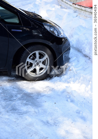 A car that can not move on a snowy road A car that can not move on a snowy road 36940494