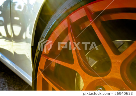 Car wheels close up on tires with red rims Car wheels close up on tires with red rims 36940658