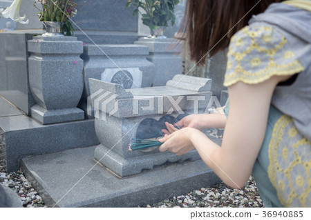 visiting a grave, grave, tomb 36940885