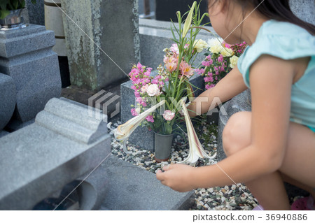 visiting a grave, younger, person 36940886