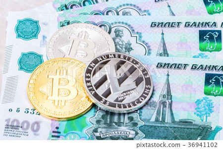 Cryptocurrency coins lying on the russian ruble 36941102