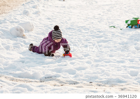 Kid plays on the snow Kid plays on the snow 36941120