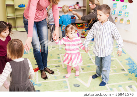 Group of little children dancing Group of little children dancing 36941576