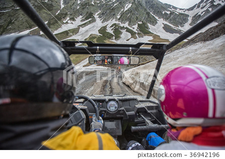 Buggy mountains driving on the road with snow Buggy mountains driving on the road with snow 36942196