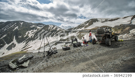 Buggy mountains driving on the road with snow Buggy mountains driving on the road with snow 36942199
