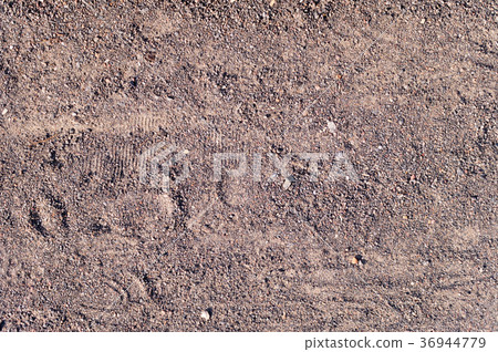 sandy path with boot tracks. background, texture. sandy path with boot tracks. background, texture. 36944779