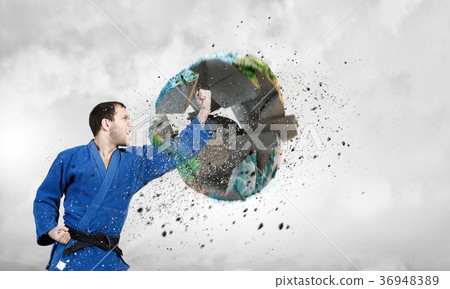 Karate man in blue kimino Karate man in blue kimino 36948389