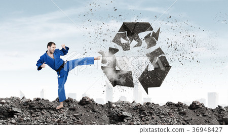 Karate man in blue kimino Karate man in blue kimino 36948427
