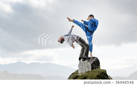 Karate man in blue kimino Karate man in blue kimino 36948548