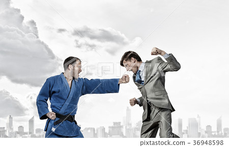 Karate man in blue kimino Karate man in blue kimino 36948598