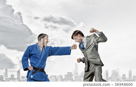 Karate man in blue kimino Karate man in blue kimino 36948600