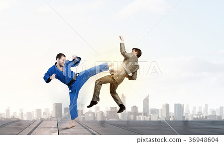 Karate man in blue kimino Karate man in blue kimino 36948604