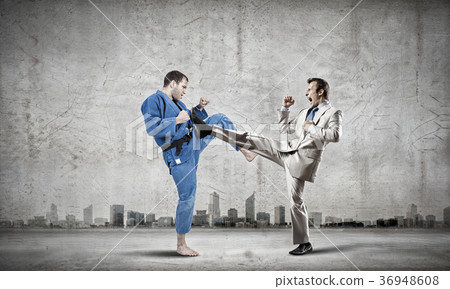 Karate man in blue kimino Karate man in blue kimino 36948608