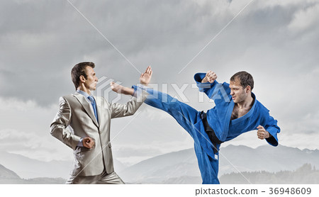 Karate man in blue kimino Karate man in blue kimino 36948609