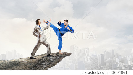 Karate man in blue kimino Karate man in blue kimino 36948611