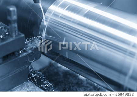 The  lathe machine cutting the steel rod 36949838