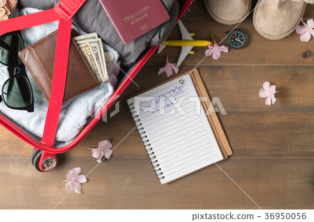 Plan trip on notebook and prepare accessories  36950056