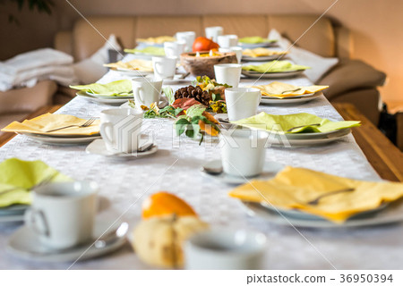 Beautiful festive dinner table colorful yellow 36950394
