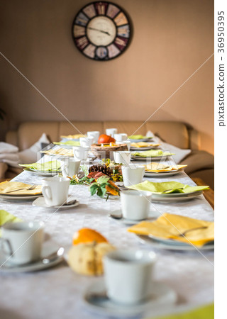 Beautiful festive dinner table colorful yellow 36950395