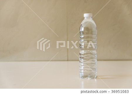 Bottle of water on white table Bottle of water on white table 36951083