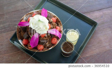 Brownie and watermelon Bingsu dessert on a wooden table. 36954510