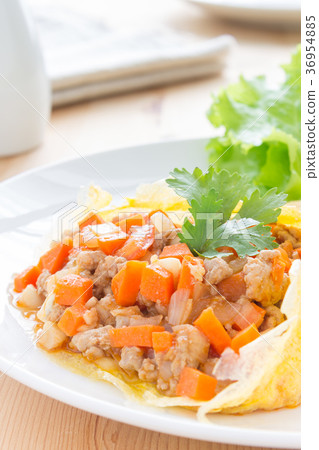 Stuffed Omelet Carrot Onion Pork on Wood Table Stuffed Omelet Carrot Onion Pork on Wood Table 36954885