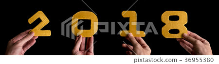 Hands holding golden numbers 2018 Hands holding golden numbers 2018 36955380