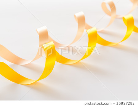 Ribbon yellow yellow curl white background 36957292