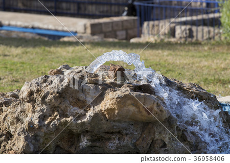 A source of pure mineral water from a stone 36958406