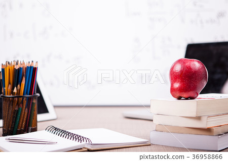 Books, notebook and pencils on table with a Books, notebook and pencils on table with a 36958866