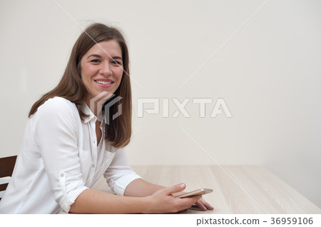 Beautiful positive young woman with smartphone 36959106