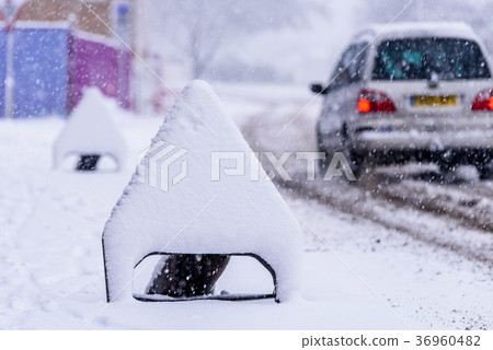Snow covered road sign on UK motorway Road Snow covered road sign on UK motorway Road 36960482
