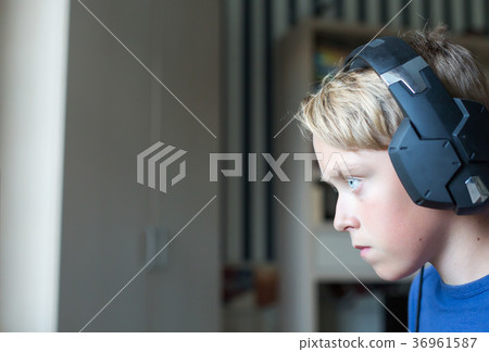 Teenage boy playing computer games on PC 36961587