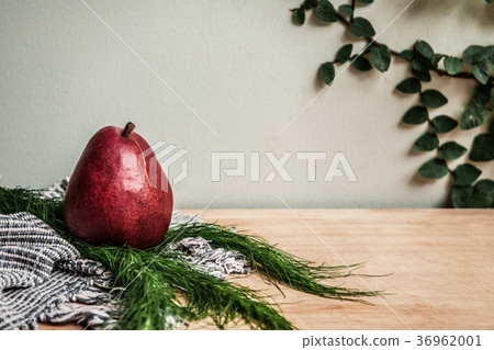 Healthy Fresh red pear, fabric and green leaf 36962001
