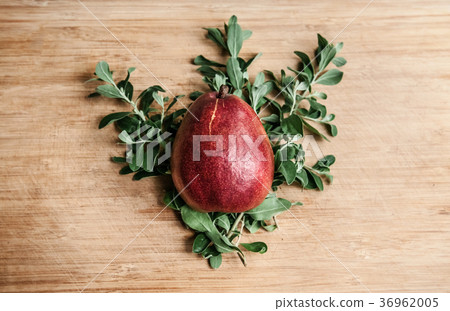 Fresh ripe red pear on leaf wooden background 36962005