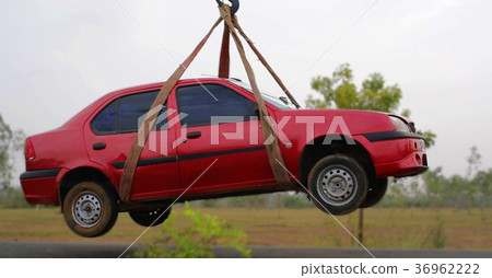 towing damaged car over a tow truck towing damaged car over a tow truck 36962222