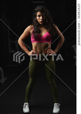 Young woman stand in gym Young woman stand in gym 36962620