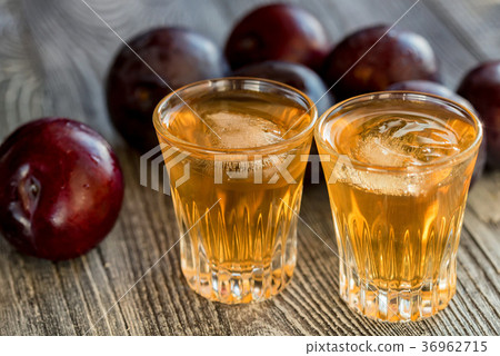 Plum brandy or slivovitz with fresh and tasty plum 36962715
