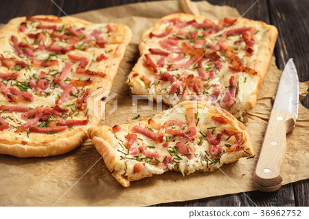 Tarte flambee, traditional alsatian pizza. Tarte flambee, traditional alsatian pizza. 36962752
