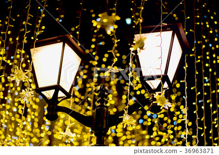 Metal lantern on background of neon garland, as Metal lantern on background of neon garland, as 36963871
