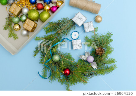 Making a Christmas wreath. Christmas balls, ribbon 36964130