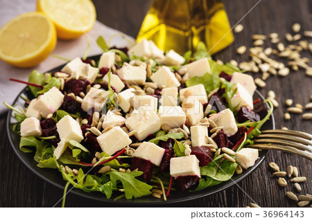Healthy beetroot salad with feta cheese, arugula Healthy beetroot salad with feta cheese, arugula 36964143