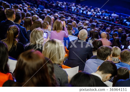 People attend business conference in congress hall 36964151