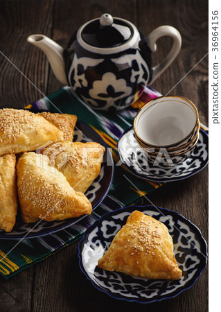 Puff pastries with meat (samosa). 36964156