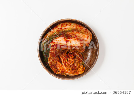 Kimchi in a wooden bowl isolated Kimchi in a wooden bowl isolated 36964197