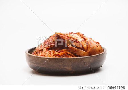 Kimchi in a wooden bowl isolated 36964198