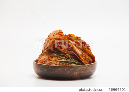 Kimchi in a wooden bowl isolated Kimchi in a wooden bowl isolated 36964201