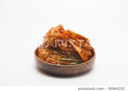 Kimchi in a wooden bowl isolated Kimchi in a wooden bowl isolated 36964202