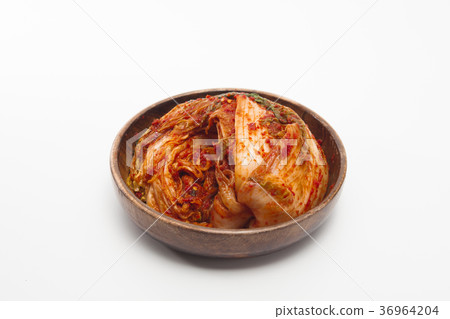 Kimchi in a wooden bowl isolated Kimchi in a wooden bowl isolated 36964204