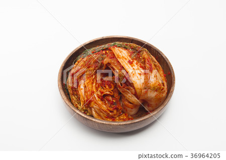 Kimchi in a wooden bowl isolated Kimchi in a wooden bowl isolated 36964205